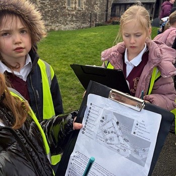 Pupils  holding a map of the area